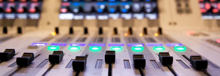 professional audio mixer in a recording studio